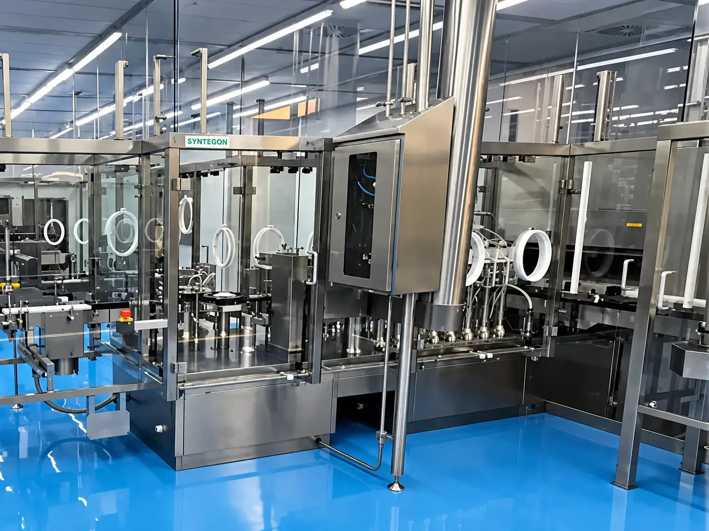 High-speed filling and packaging line with blue cleanroom flooring
